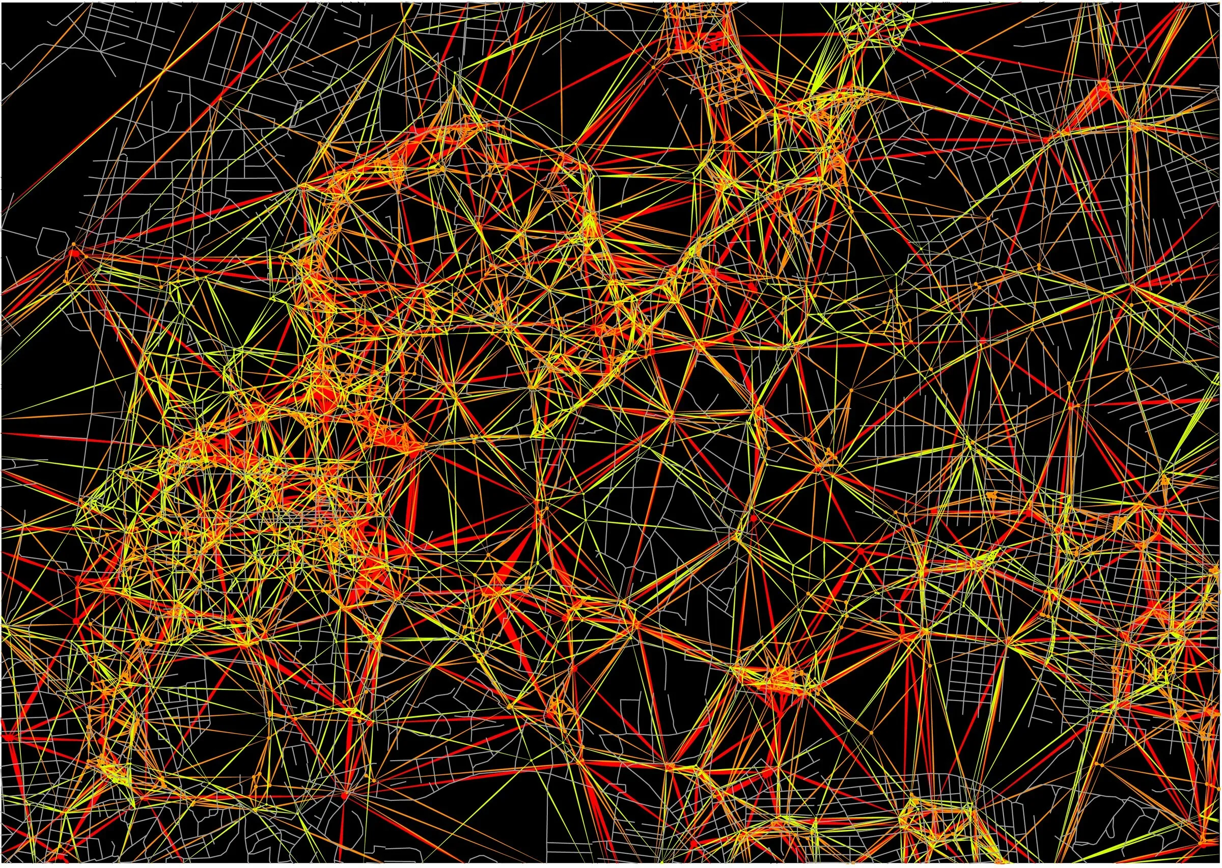 A dense web of red, green and yellow lines maps the old city outline against black.