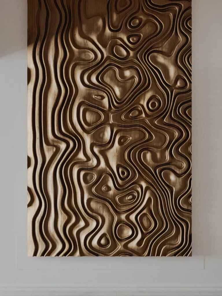 A carved wooden panel with flowing contours and rounded hollows stands against a pale wall.